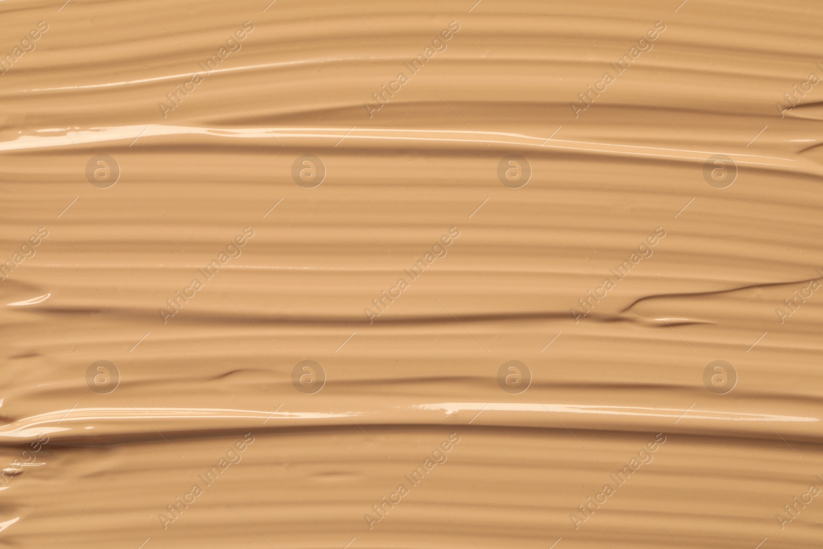 Photo of Texture of liquid skin foundation as background, closeup