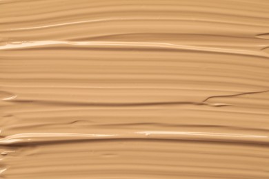 Texture of liquid skin foundation as background, closeup