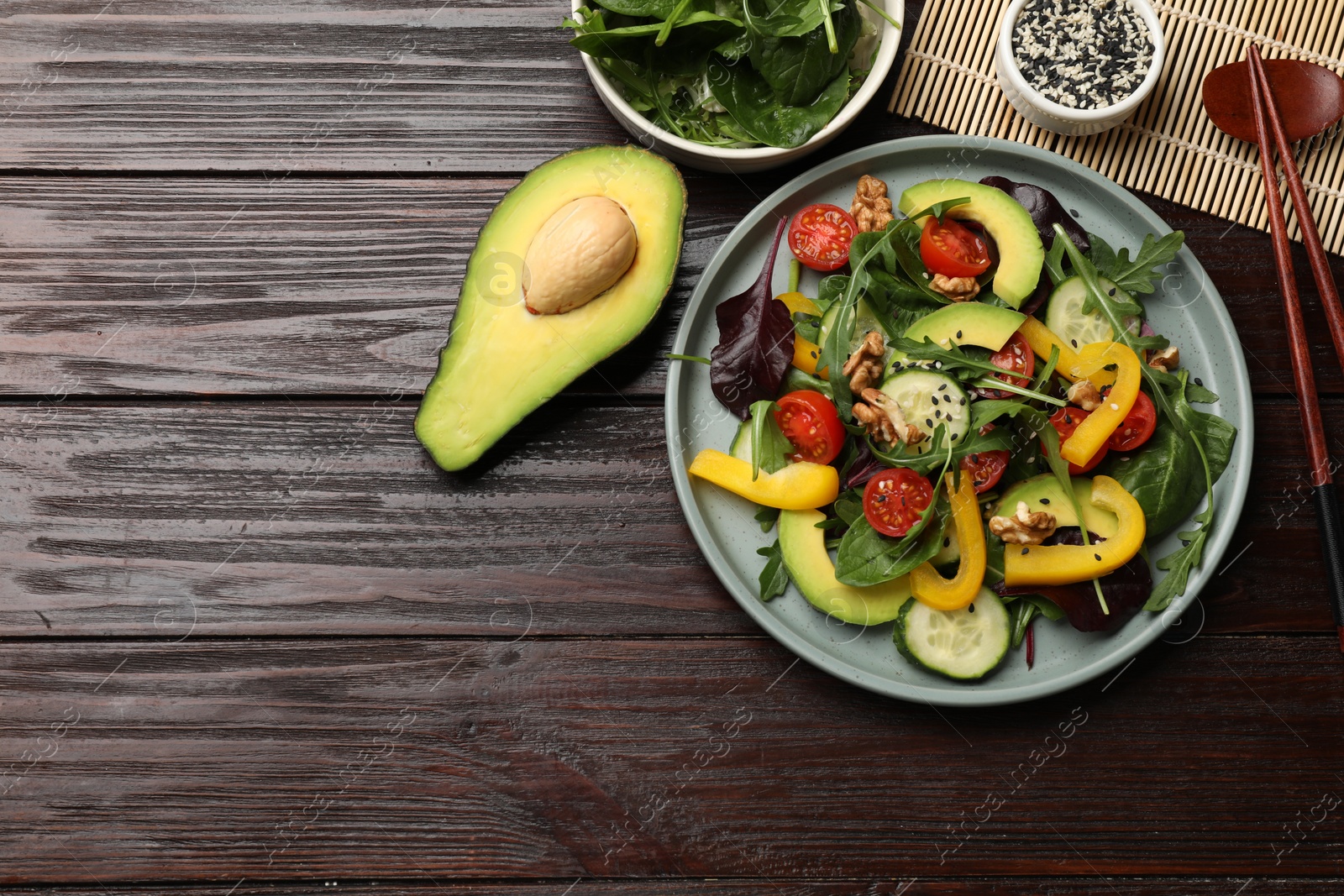 Photo of Balanced diet and vegetarian foods. Plate with different delicious products on wooden table, flat lay. Space for text