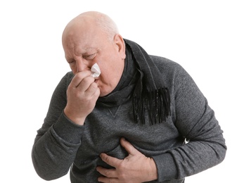 Photo of Senior man suffering from cold on white background