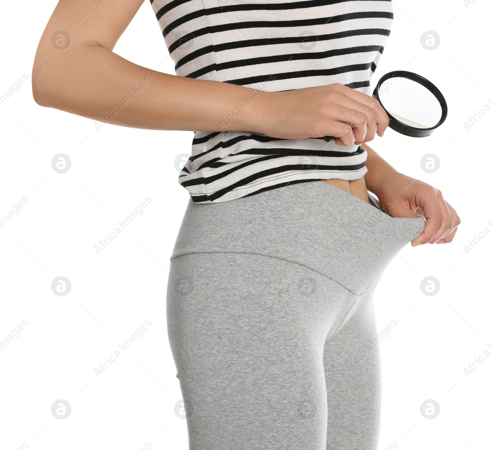 Photo of Woman examining genital herpes with magnifying glass on white background, closeup