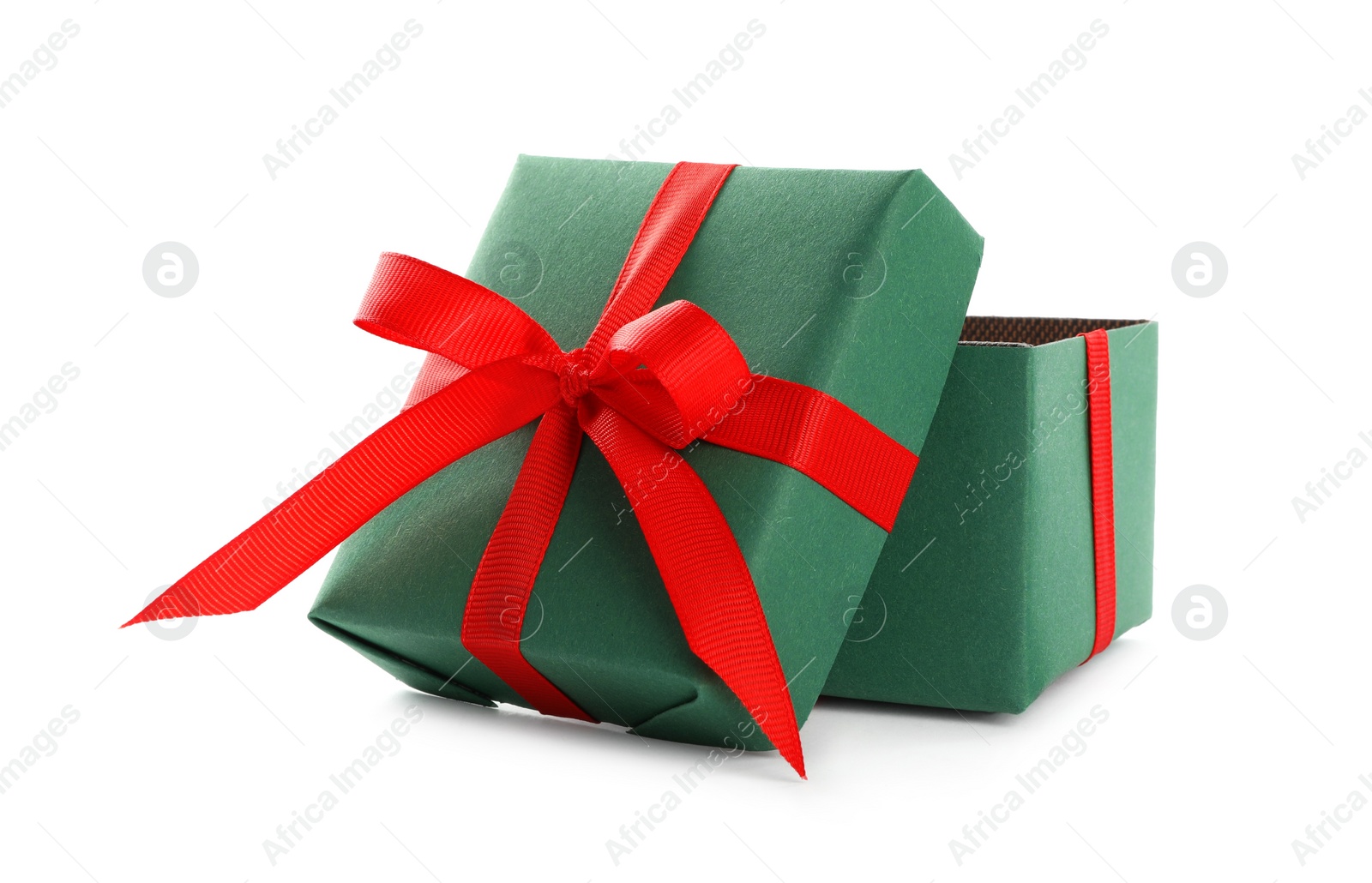 Photo of Christmas gift box decorated with red bow isolated on white