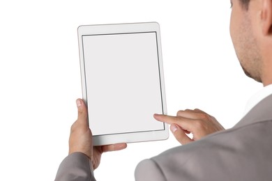 Man using tablet with blank screen on white background, closeup. Mockup for design