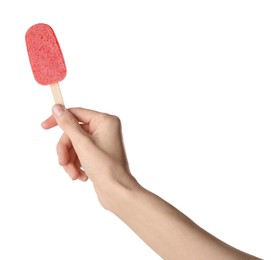 Photo of Woman holding tasty fruit ice pop on white background, closeup