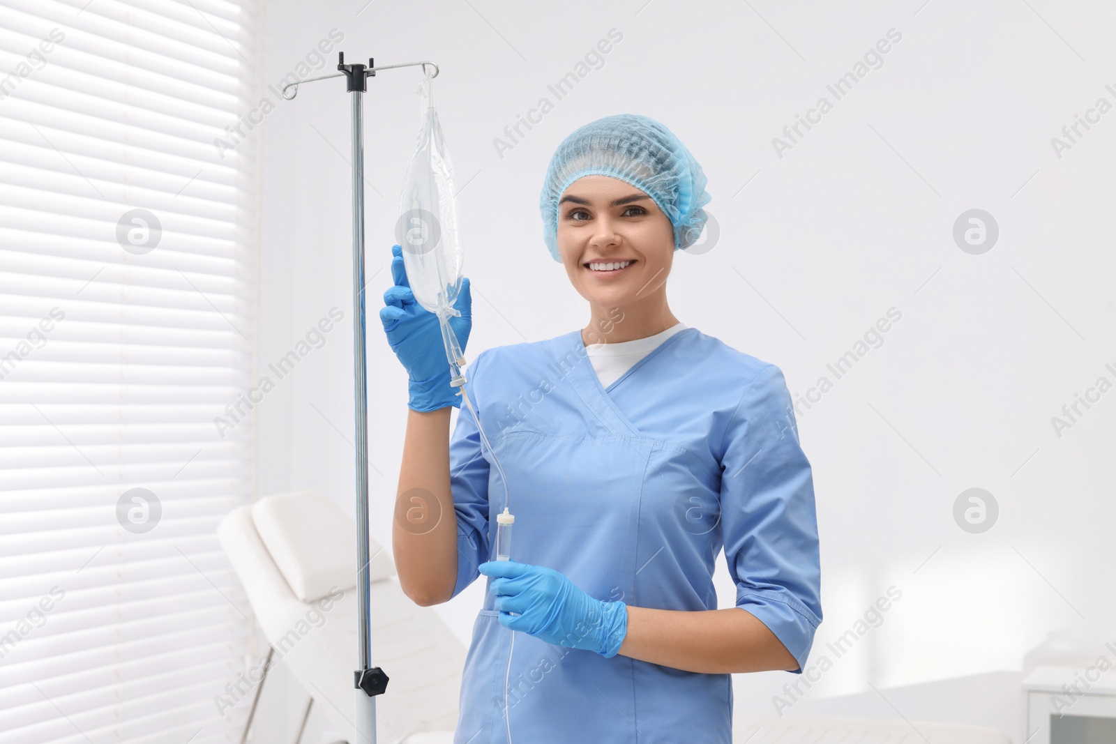 Photo of Nurse setting up IV drip in hospital