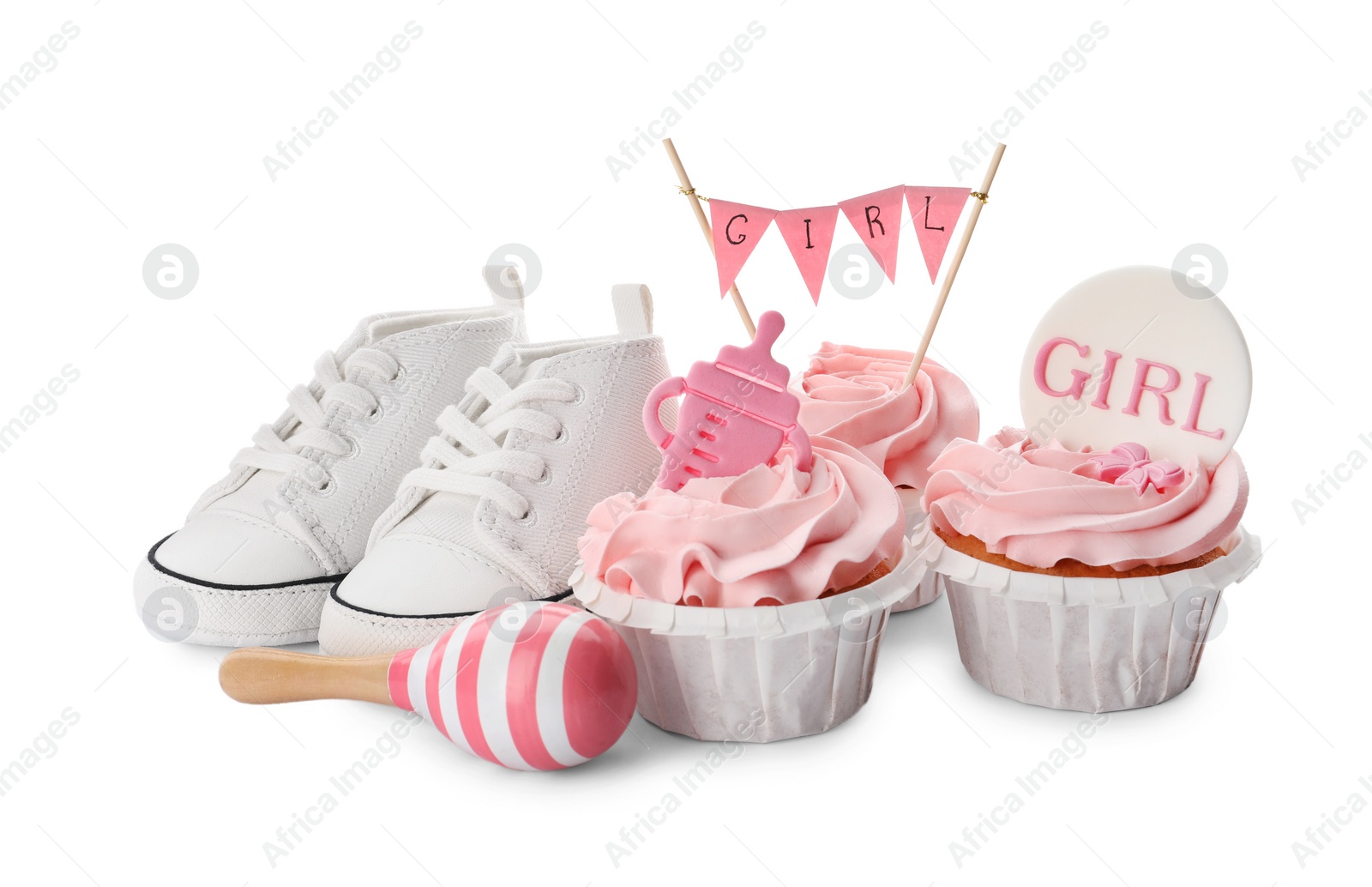 Photo of Baby shower cupcakes with toppers near shoes and toy on white background