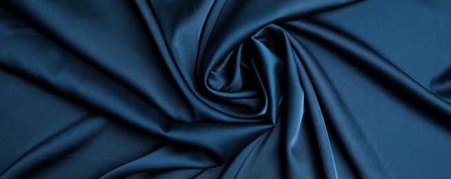 Crumpled dark blue silk fabric as background, top view. Banner design