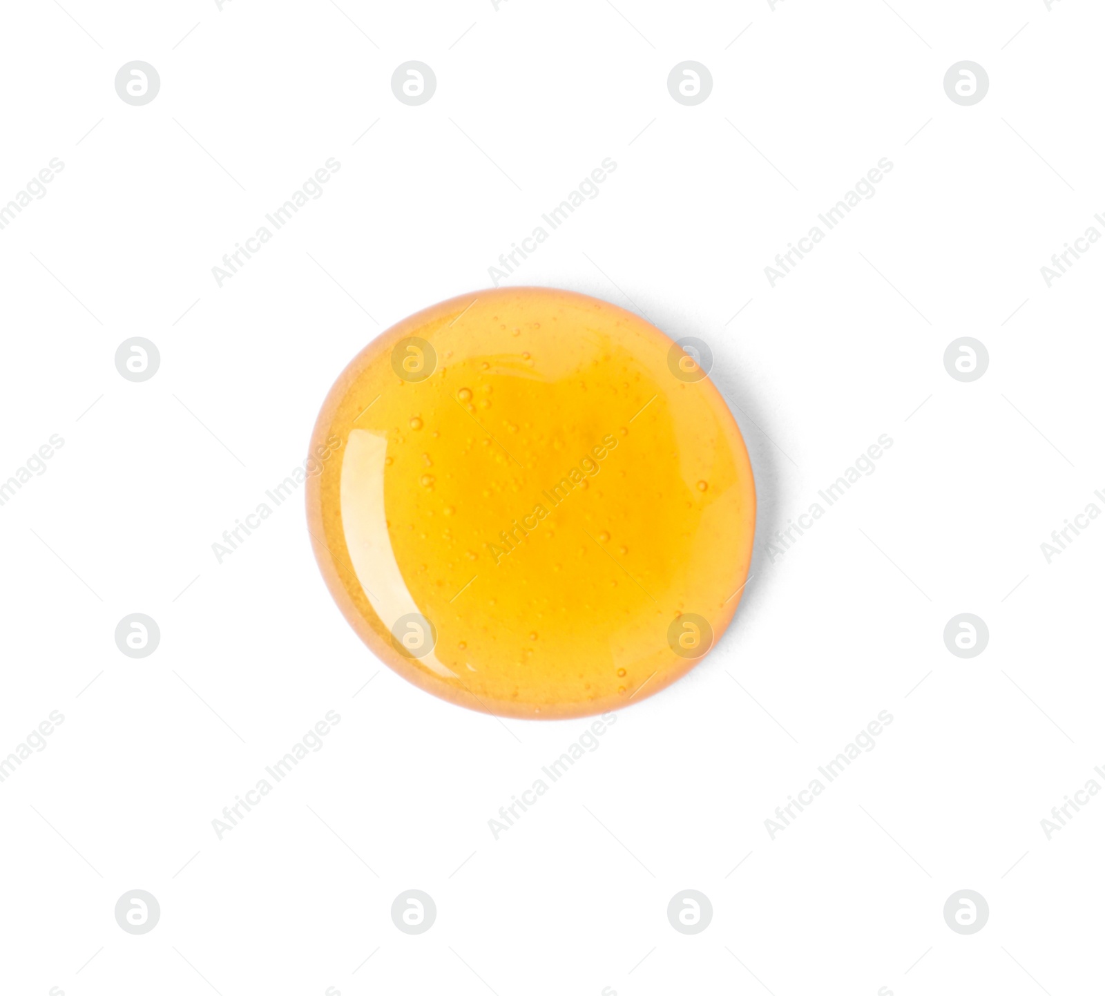Photo of Drop of sweet honey on white background, top view