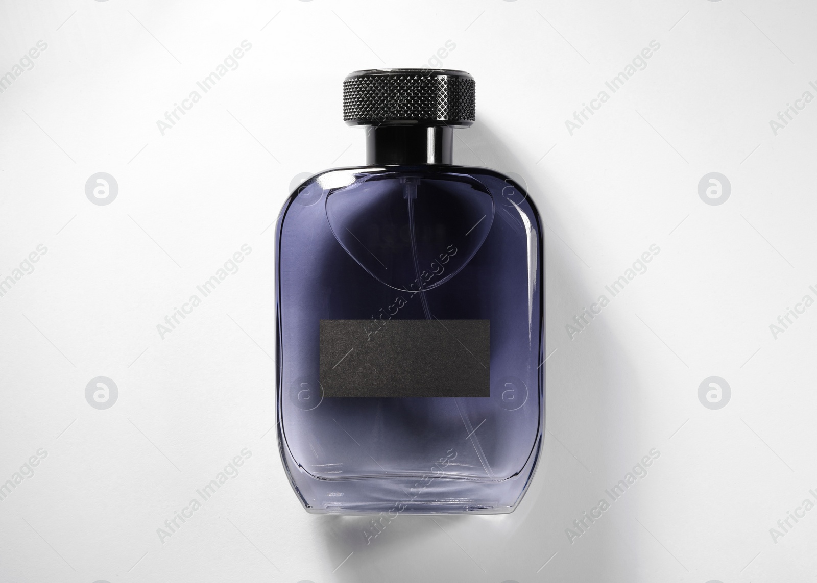 Photo of Luxury men`s perfume in bottle on white background, top view