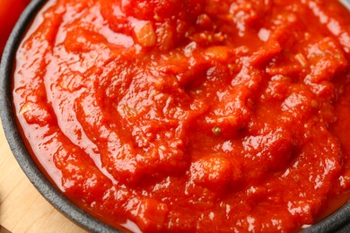 Photo of Homemade tomato sauce in bowl on table, closeup