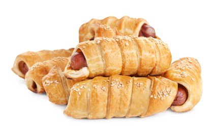 Many delicious sausage rolls isolated on white