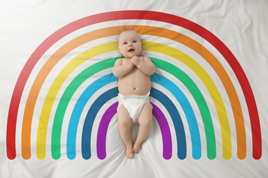 Image of National rainbow baby day. Cute child lying on blanket with colorful pattern, top view