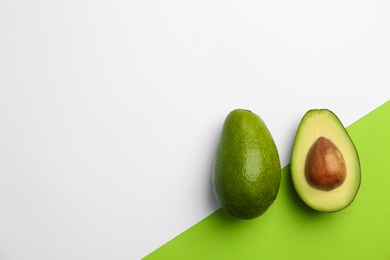 Photo of Flat lay composition with ripe avocados on color background