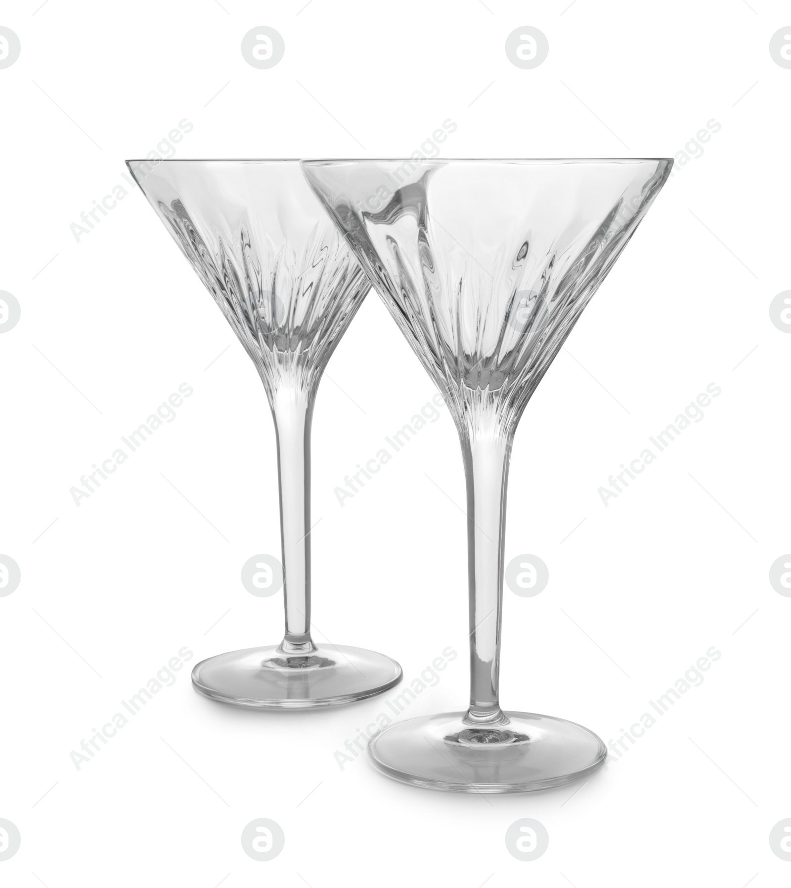 Photo of Elegant clean empty martini glasses isolated on white