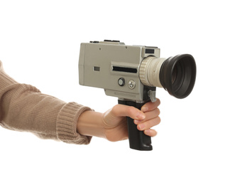 Woman with vintage video camera on white background, closeup of hand