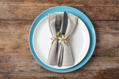 Beautiful table setting on wooden background, flat lay