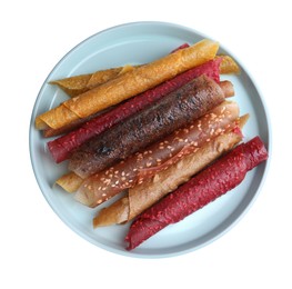 Photo of Delicious fruit leather rolls on white background, top view