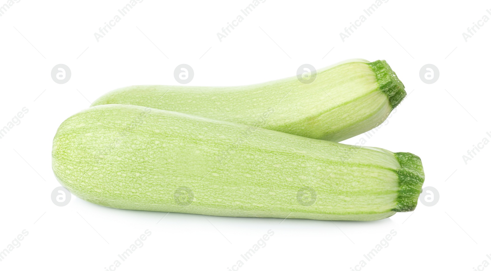 Photo of Raw green ripe zucchinis isolated on white