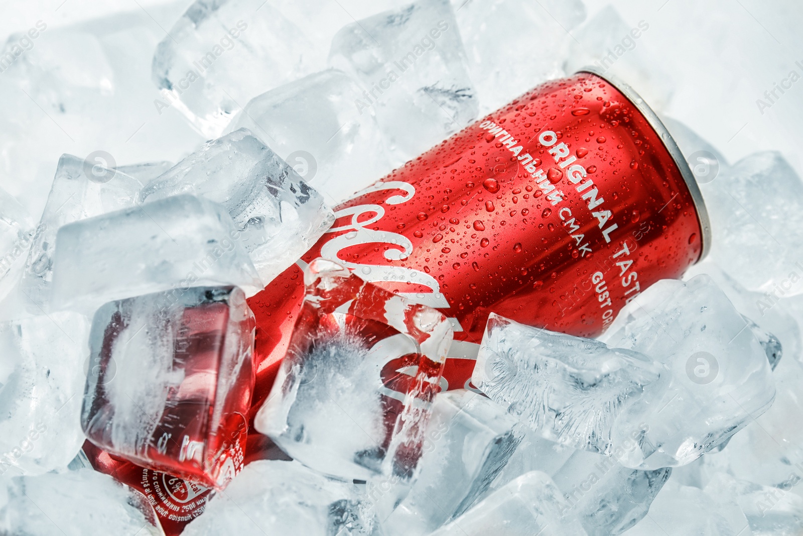 Photo of MYKOLAIV, UKRAINE - NOVEMBER 15, 2018: Coca Cola can on ice cubes, closeup