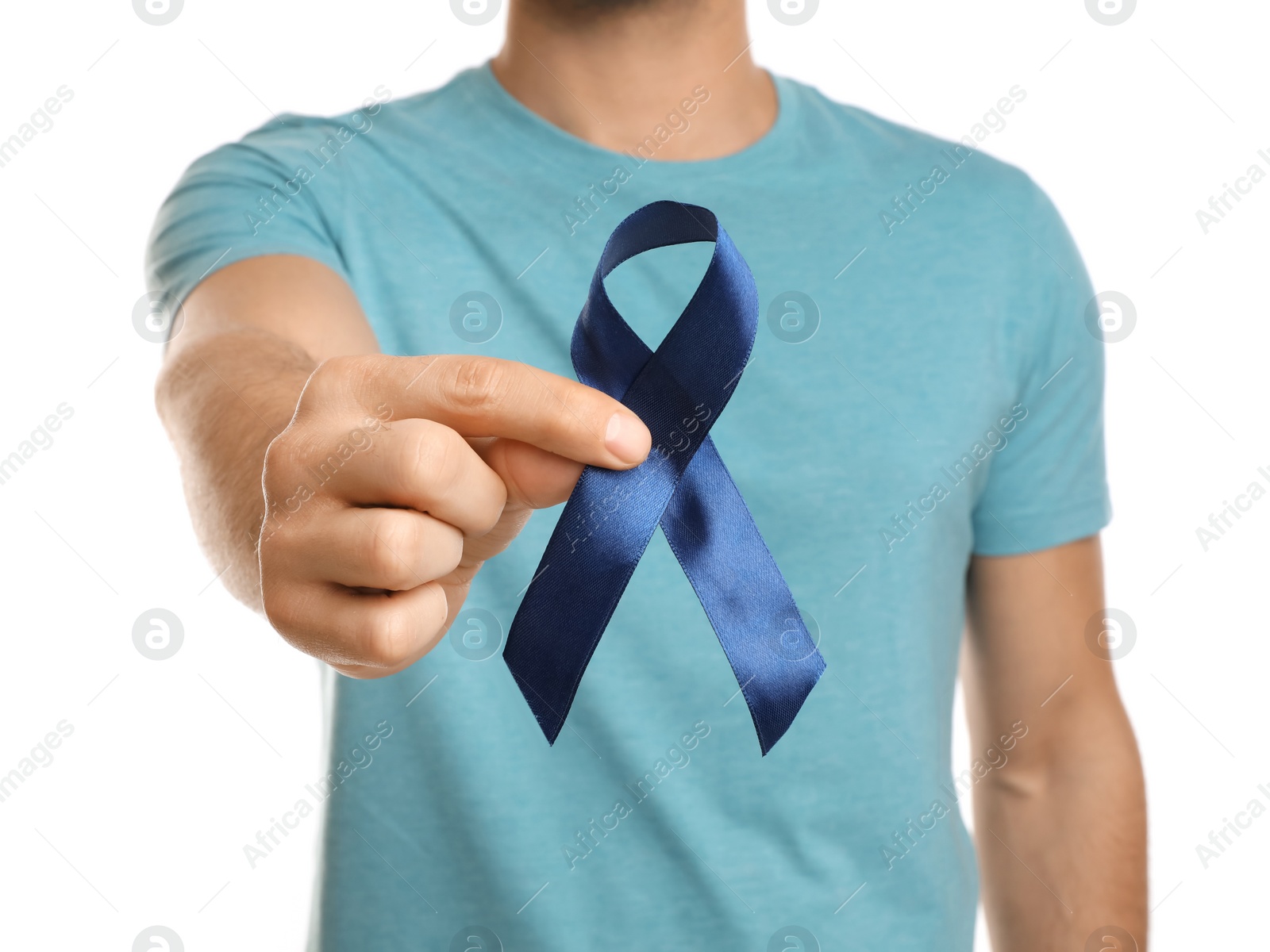 Photo of Man with blue ribbon on white background, closeup. Urology cancer awareness