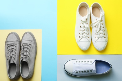 Photo of Flat lay composition with different sneakers on color background