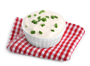 Fresh sour cream with onion and fabric on white background