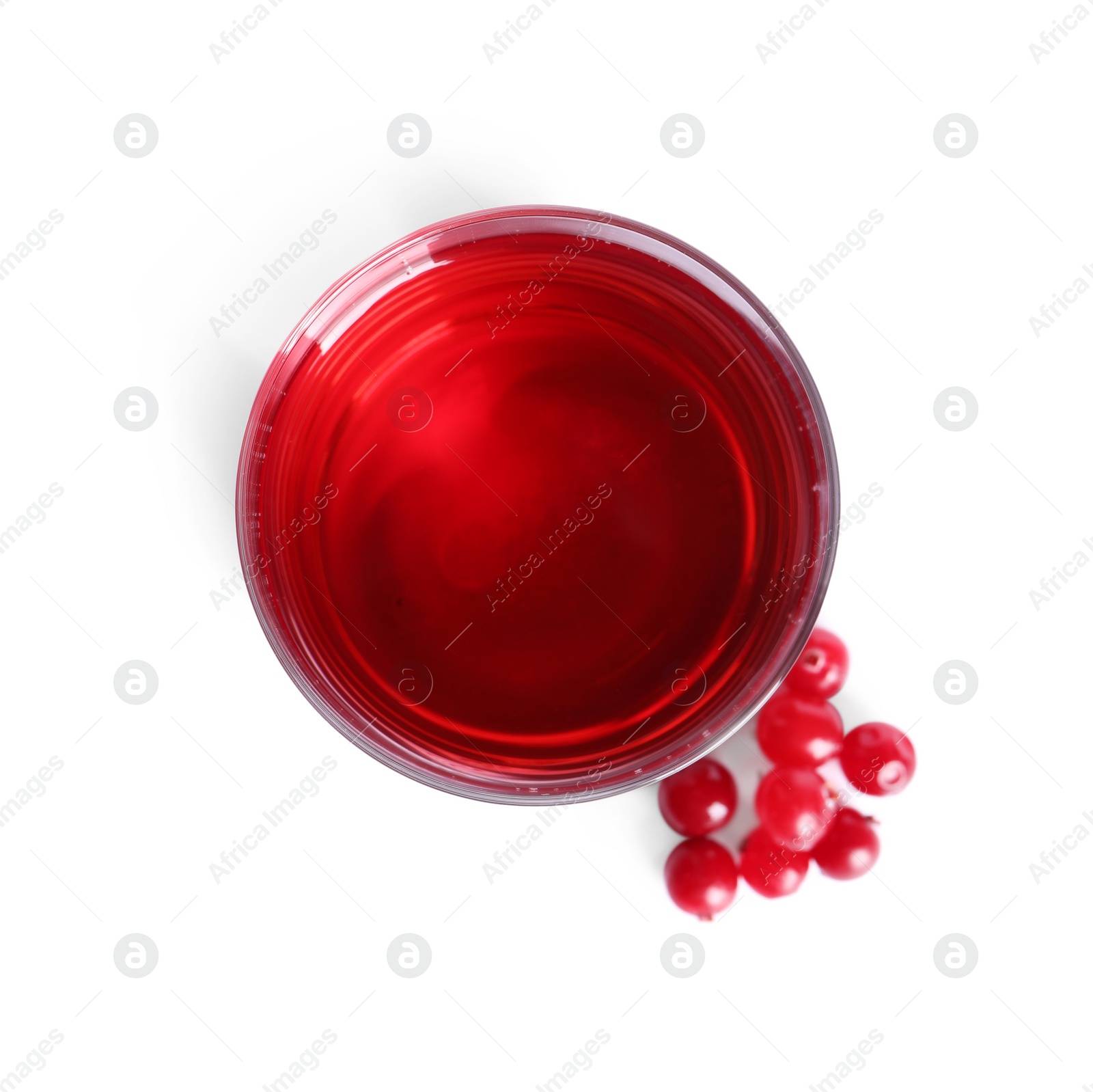 Photo of Tasty refreshing cranberry juice in glass and fresh berries isolated on white, top view