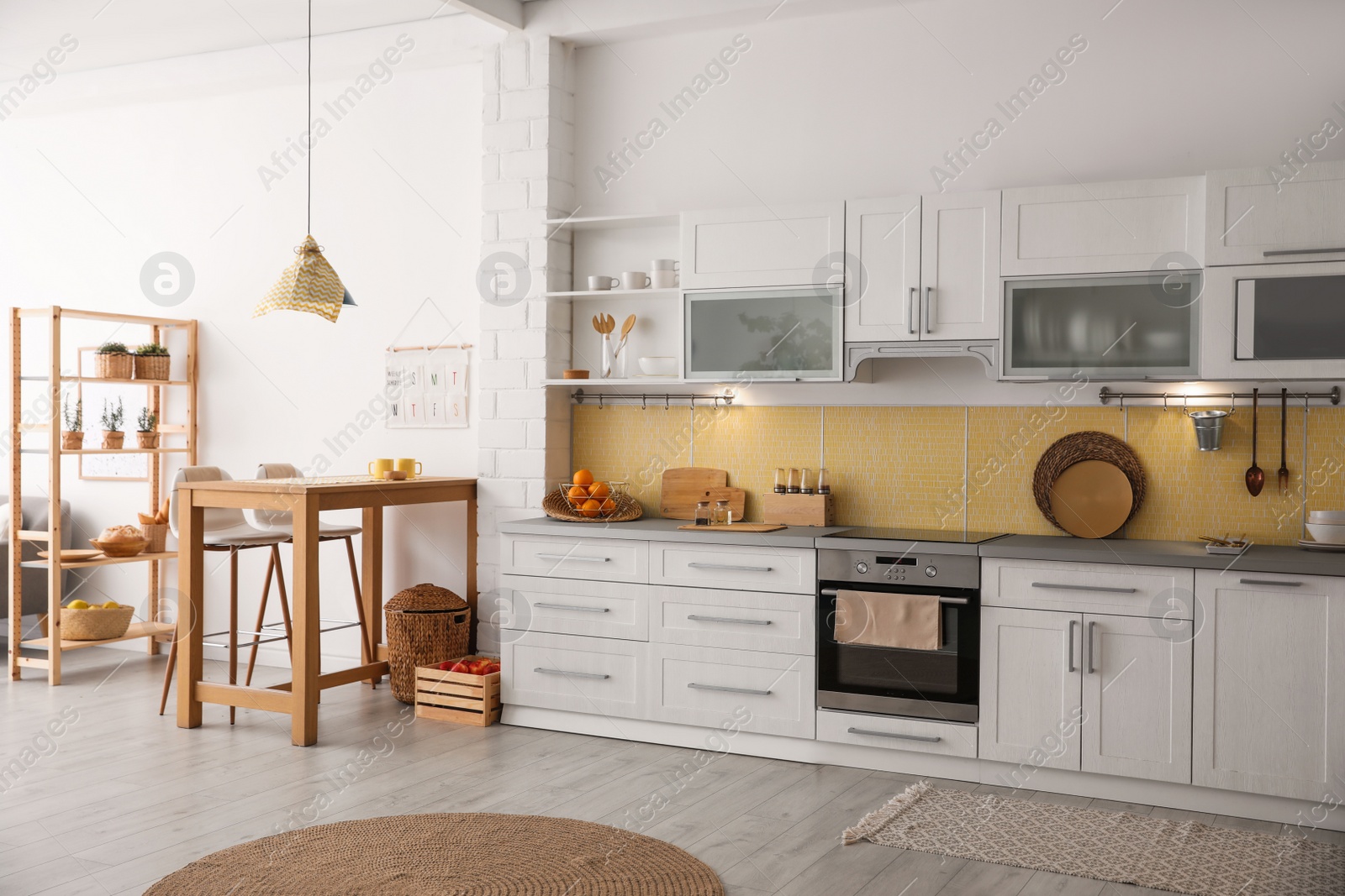 Photo of Modern kitchen interior with stylish wooden table