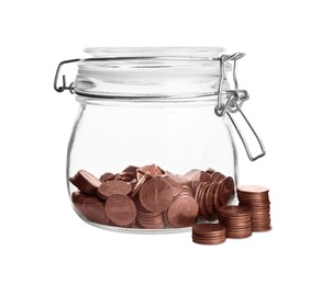 Glass jar of money and stack with coins isolated on white