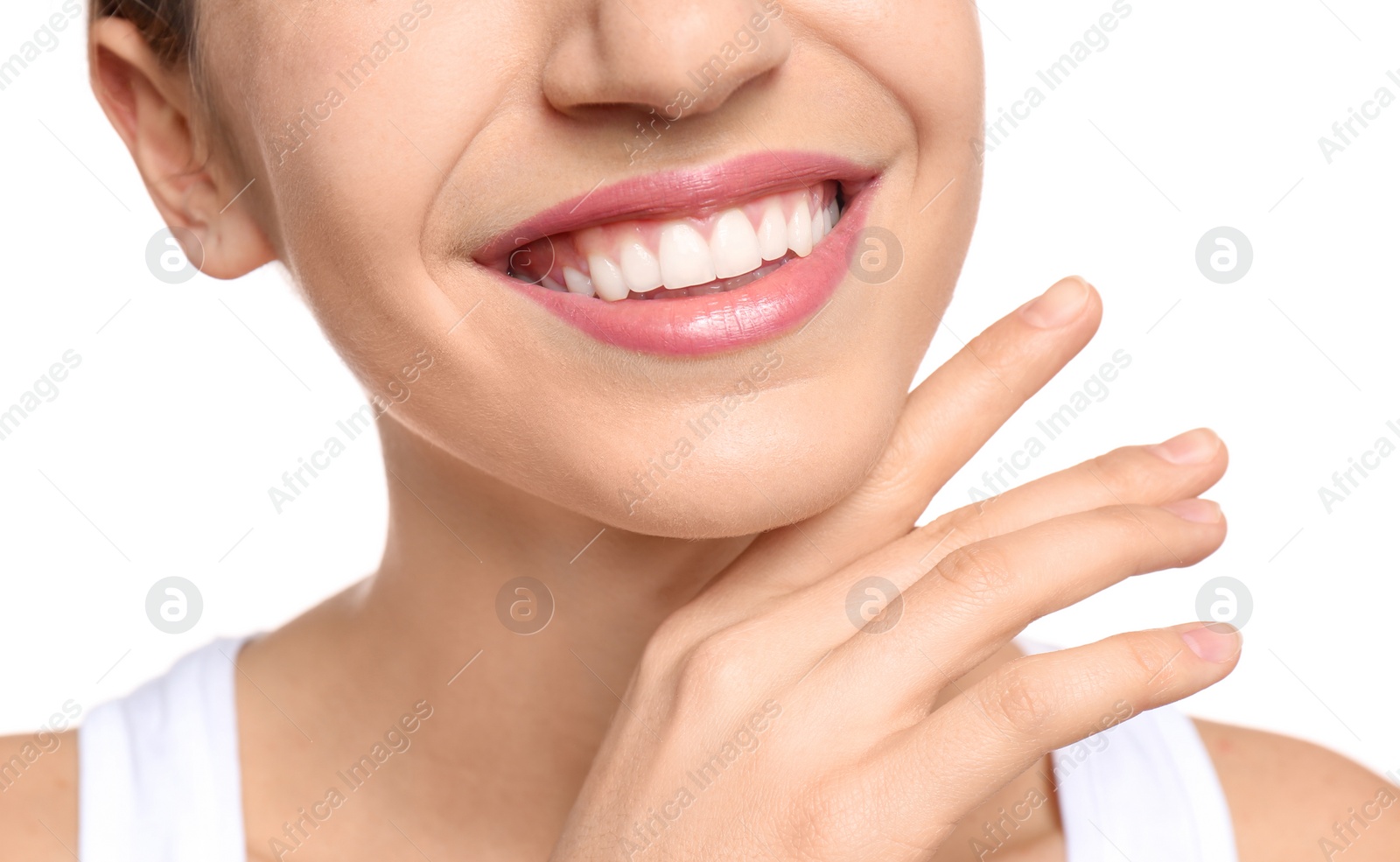 Photo of Young woman with beautiful smile on white background, closeup. Teeth whitening