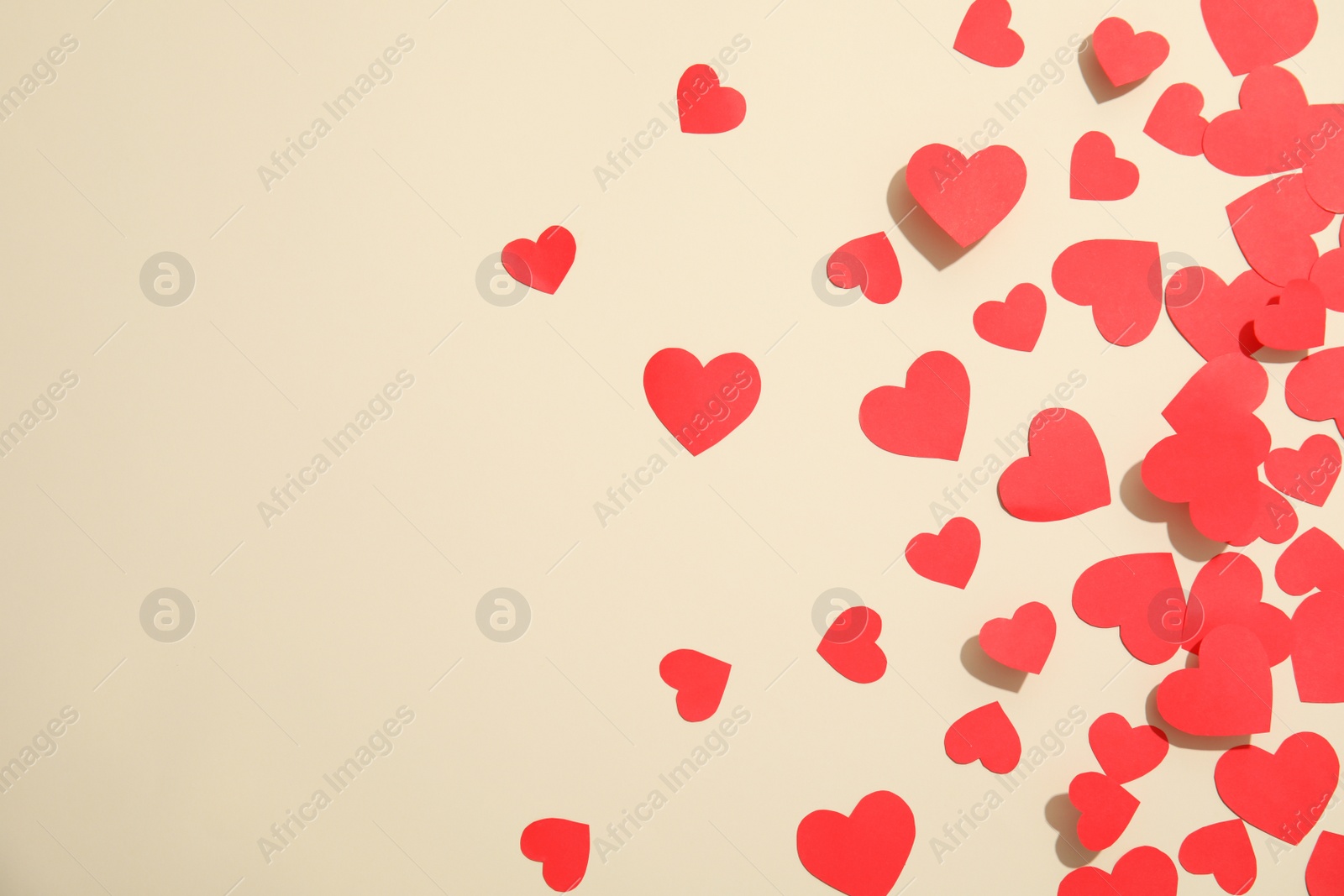 Photo of Small paper hearts on color background, top view