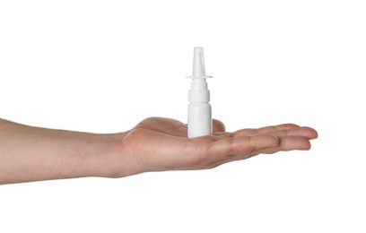 Photo of Man holding nasal spray on white background, closeup