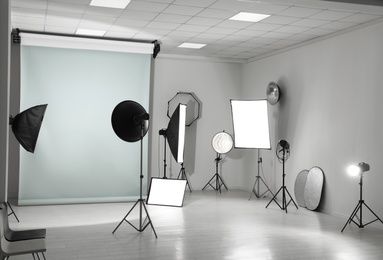 Interior of modern photo studio with professional equipment