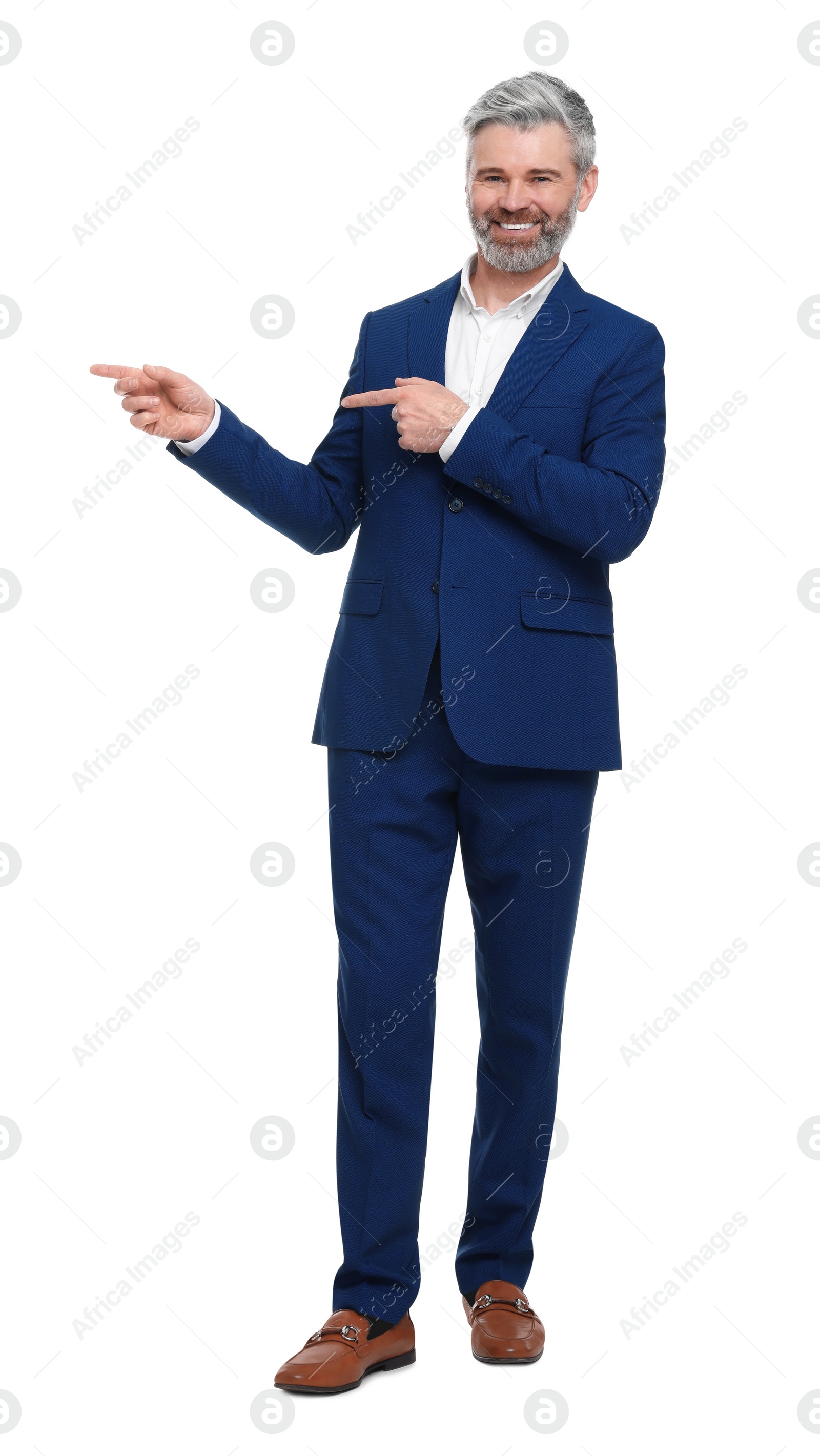 Photo of Mature businessman in stylish clothes posing on white background