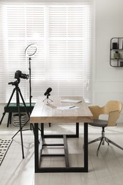 Photo of Ring light, camera and microphone for blogging in room