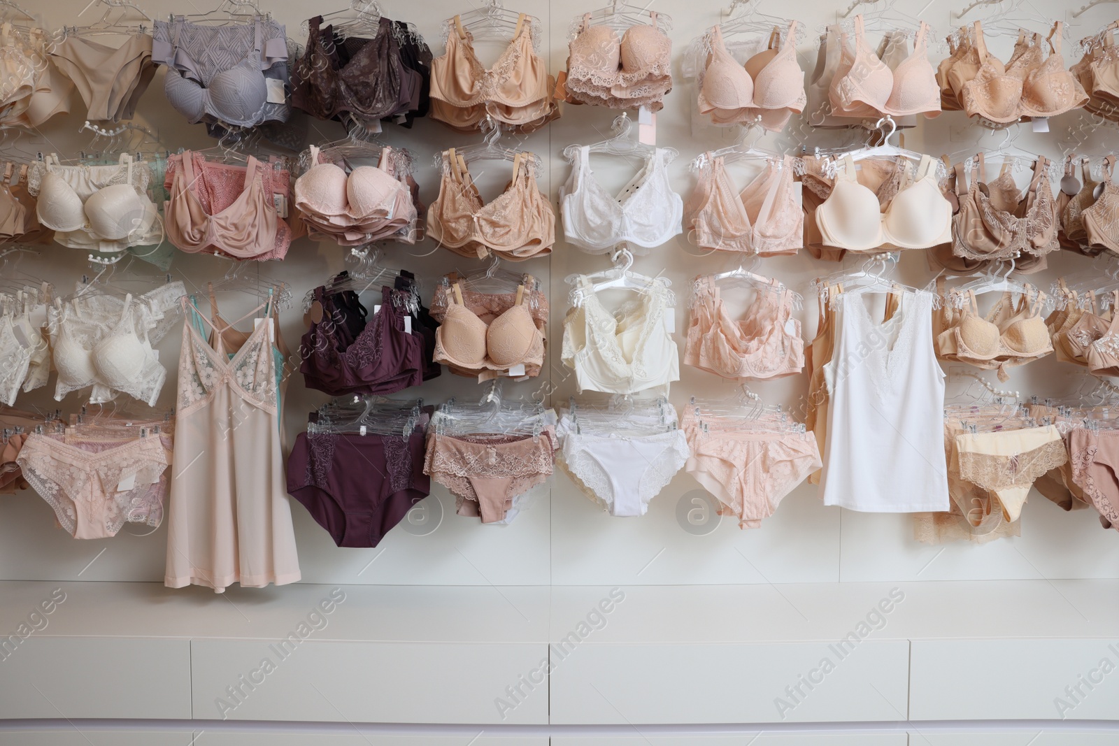 Photo of Many different beautiful women's underwear in lingerie store