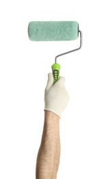 Photo of Man holding paint roller brush on white background, closeup