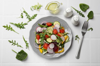 Balanced diet and vegetarian foods. Plate with different delicious products on white tiled table, flat lay