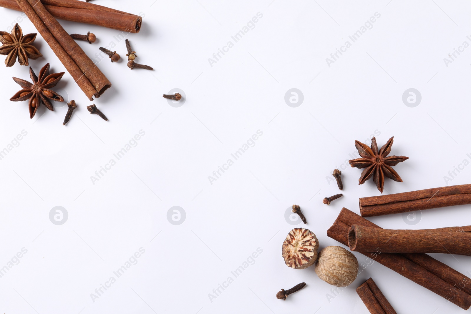 Photo of Different spices on white table, flat lay. Space for text