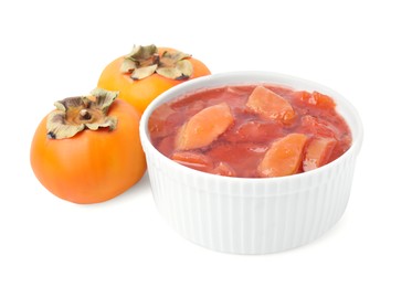 Bowl of tasty persimmon jam and fresh fruits on white background