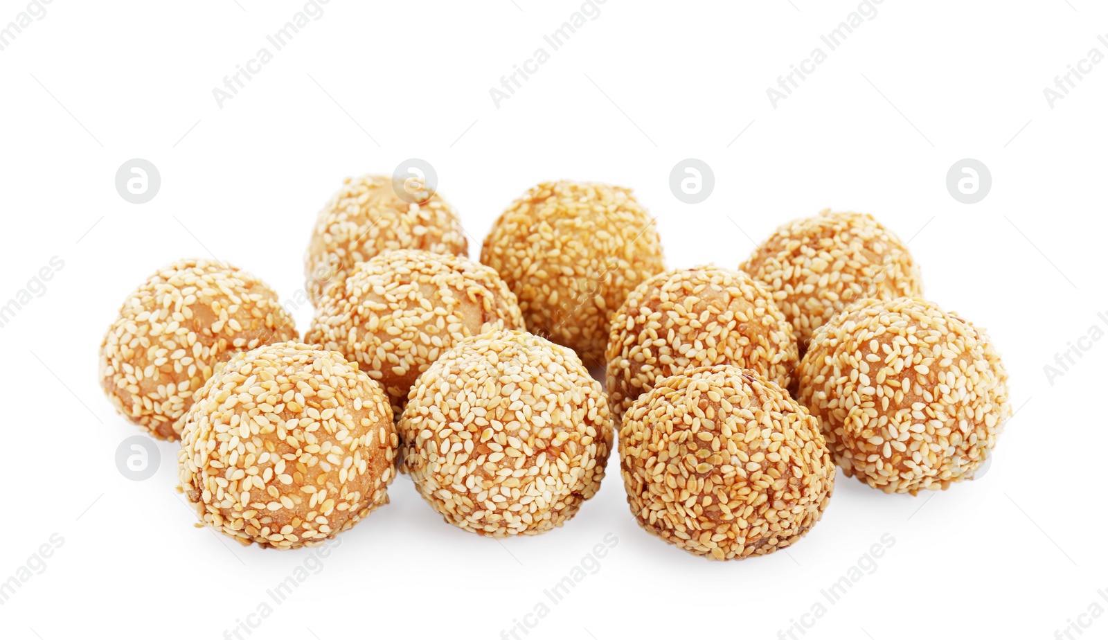 Photo of Many delicious sesame balls on white background