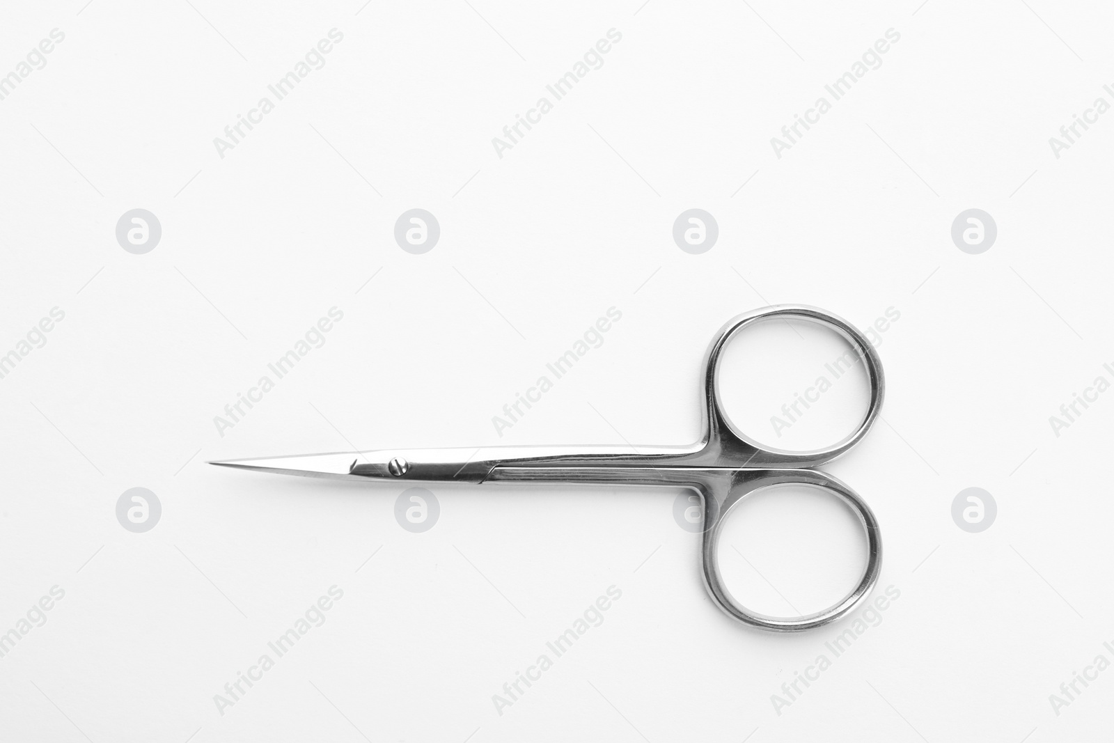 Photo of Pair of nail scissors on white background