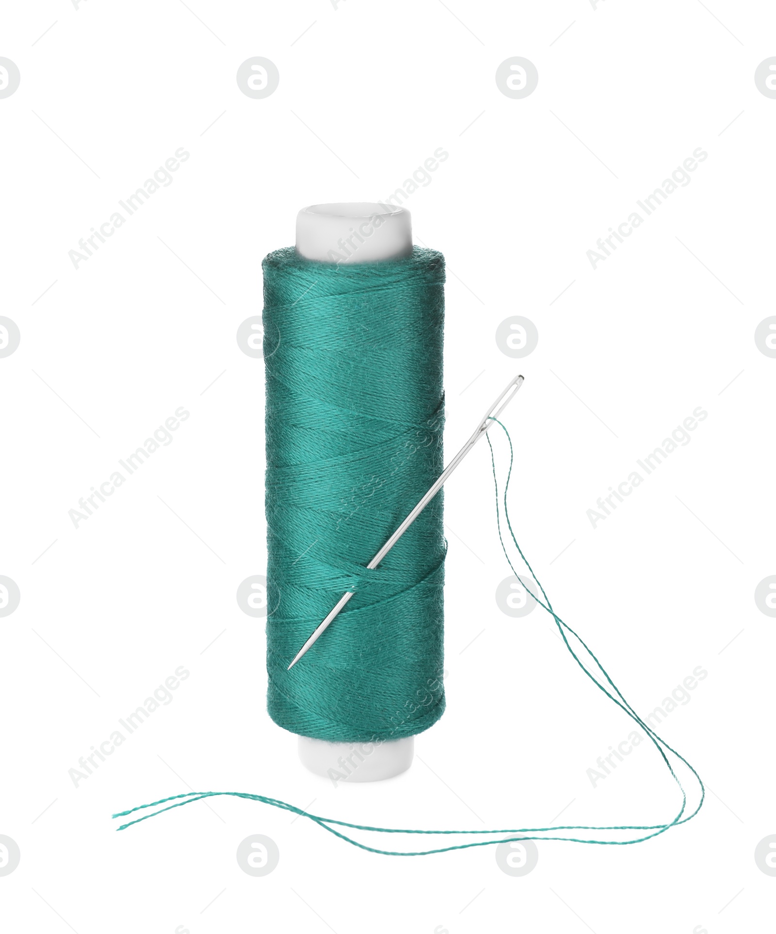 Photo of Bright sewing thread with needle isolated on white