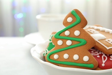 Photo of Plate with tasty homemade Christmas cookies, closeup