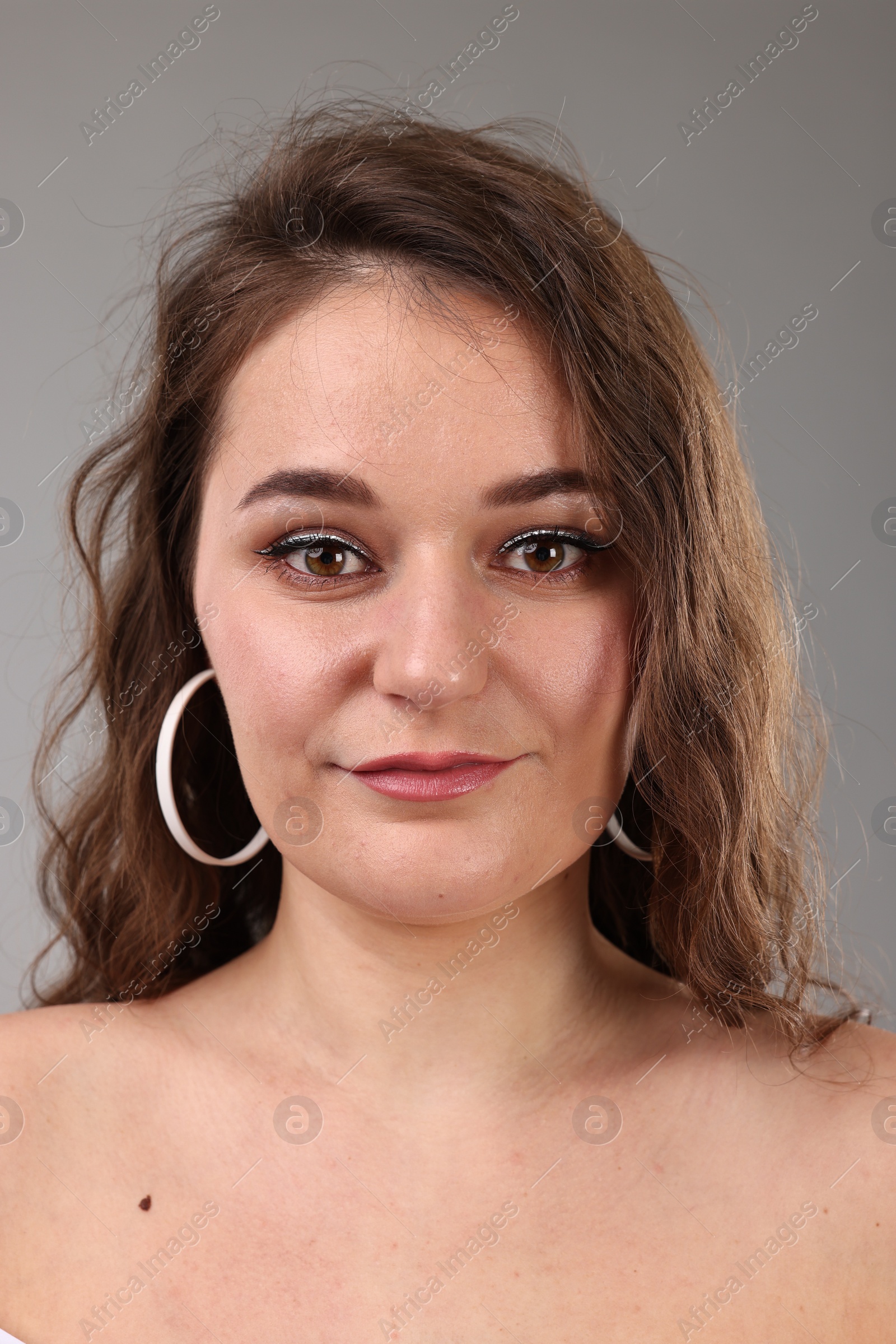 Photo of Portrait of beautiful woman on light grey background