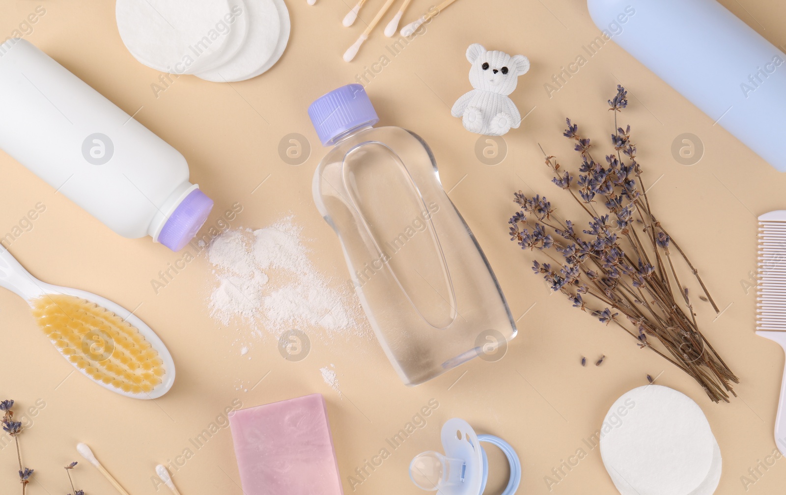 Photo of Flat lay composition with baby care products and accessories on beige background