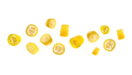 Image of Set with pieces of ripe yellow chili peppers on white background 