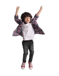Photo of Cute little boy jumping on white background