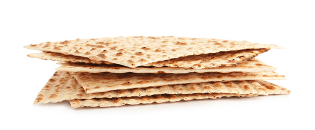 Photo of Passover matzos isolated on white. Pesach celebration