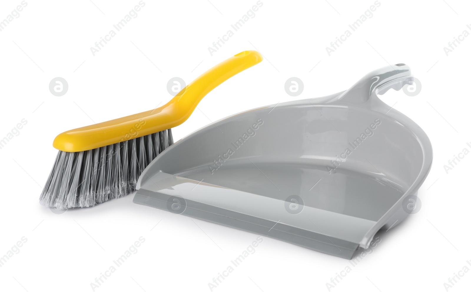 Photo of Plastic hand broom and dustpan on white background